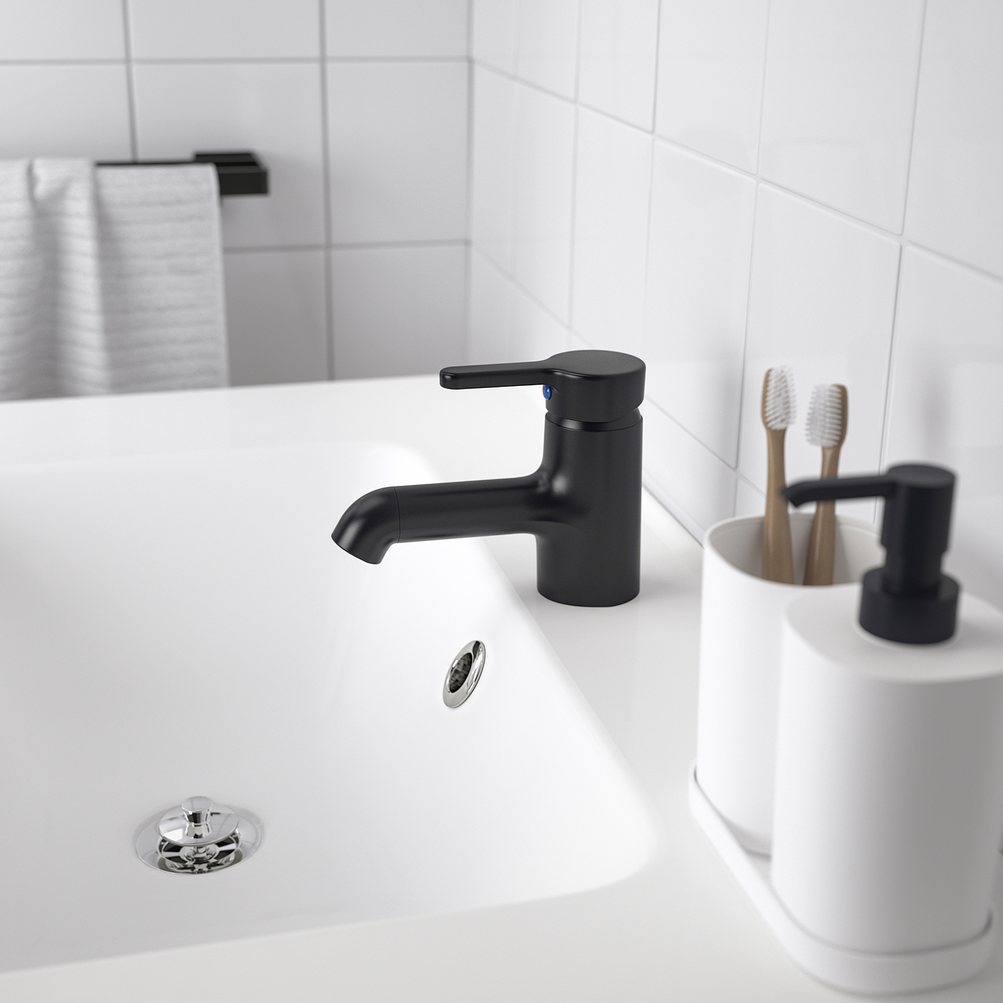 A modern bathroom sink with a sleek black SALJEN faucet, white countertop, and a toothbrush holder.