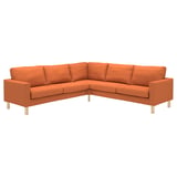 The SALTSJÖBADEN sectional sofa is a vibrant orange, modern l-shape with wooden legs, sleek lines, and plush cushions.