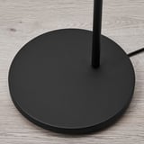 Black floor lamp base on wooden floor, sleek design, sturdy round base with central support pole, quality finish.