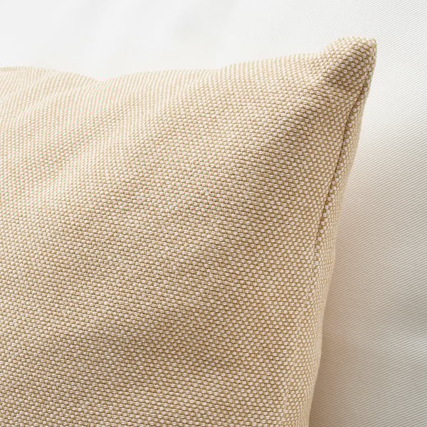 Square throw pillow with a textured, light tan fabric cover. Close-up shows soft, detailed weave and slight sheen, against a neutral beige background.