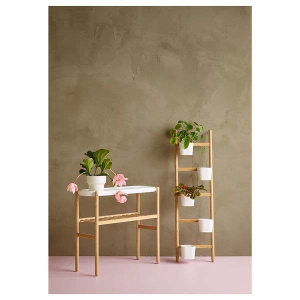 SATSUMAS plant stand, wooden with white pots, displays houseplants at varying heights for dynamic decor.