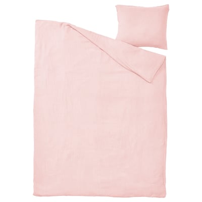A SCHERSMIN bedding set in light pink, featuring a flat duvet cover and a pillowcase, made of 100% organic cotton, with a soft, wavy texture.