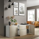 Modern living room with beige sideboard, open drawers, and decorative items. High-gloss finish, black pendant lights, and wall art.