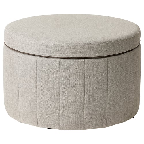 Round grey fabric storage ottoman with pleated sides and decorative piping.