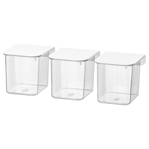 Three clear plastic storage boxes with white lids, square shape, stacked neatly for organized storage.
