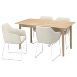 The SKANSNÄS set a light wood dining table and four upholstered chairs with armrests, combining modern design with comfort.