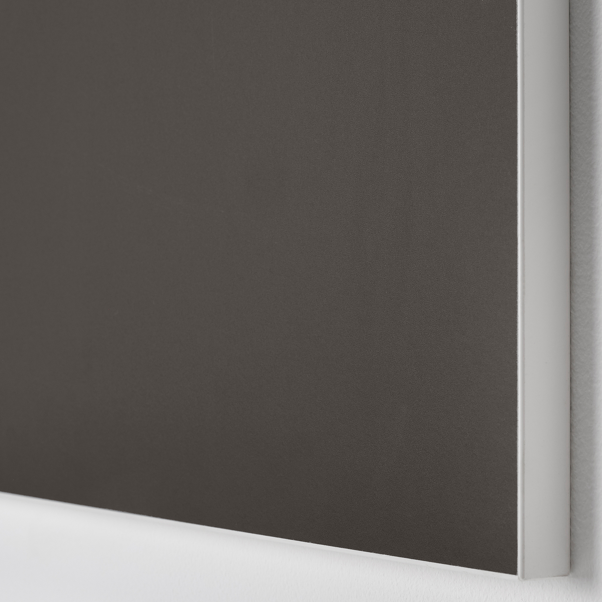 Close-up of sleek, dark cabinet door, showcasing smooth finish and clean design.