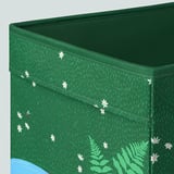 Green storage box with white flowers, soft fabric, neatly sewn.