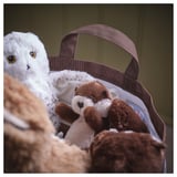 Soft toys in a brown tote bag with handles. Bag is part of the SKOGSDUVA collection.