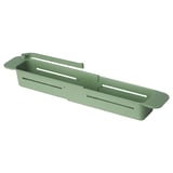 Depicts a green SKOLÄST kitchen sink organizer, featuring slots for brushes and a dishcloth holder.