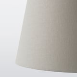 Cylindrical lampshade, soft fabric texture, beige color, classic design.