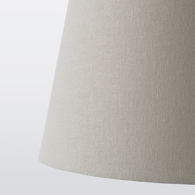 Cylindrical lampshade, soft fabric texture, beige color, classic design.
