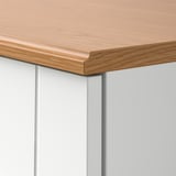 SKRUVBY cabinet corner: oak finish top, smooth texture, grooved doors, sturdy construction.