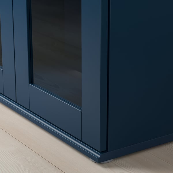 Blue cabinet with glass door.