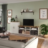Cozy living room with SKRUVBY tv stand, sofa, coffee table, and plants.