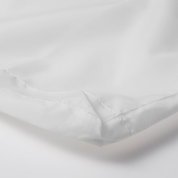 A close-up of a white, neatly stitched fabric corner, showcasing its texture and quality.