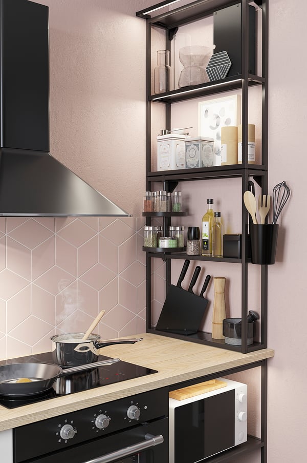 Modern kitchen with sleek black shelves, stainless appliances, pink tiles, and neatly organized cooking tools and utensils.