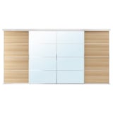 A SKYTTA white sliding closet door with wooden and glass panels.