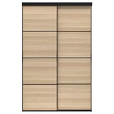 The SKYTTA wardrobe with light oak and black sliding doors featuring six panels.