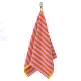 SLÅNHÖSTMAL striped towel hangs on hook. Bright orange-pink stripes with yellow trim. Soft, absorbent cotton. Rectangular shape.