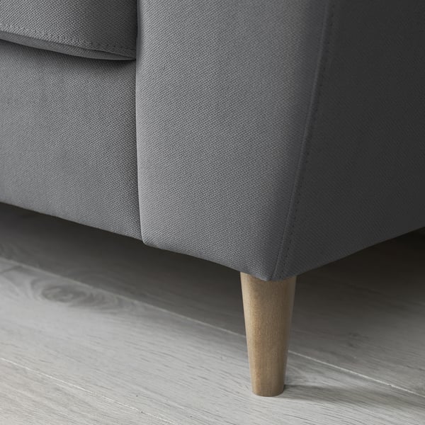 Modern grey sofa with wooden legs, showcasing high-quality fabric and sturdy design.