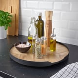 Kitchen tray with spinning feature; holds condiments and salt bowl.