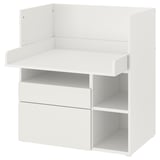A white SMÅSTAD childrens desk and changing table combo by ikea. It drawers and shelves for storage.