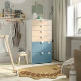 Childs room with colorful SMÅSTAD drawers. Tall, pastel storage with light wood accents, next to a window.
