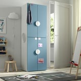 Blue wardrobe with round doors in kids room, gray, minimalist.