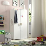 Kids SMÅSTAD wardrobe with colorful accessories in playroom.