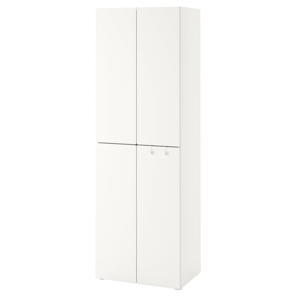 A white ikea SMÅSTAD wardrobe, a tall cabinet with two doors, adjustable feet, and hooks behind closed doors.