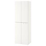 A white ikea SMÅSTAD wardrobe, a tall cabinet with two doors, adjustable feet, and hooks behind closed doors.