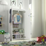 Kids wardrobe with clothes & storage bins, designed for small children to access independently.