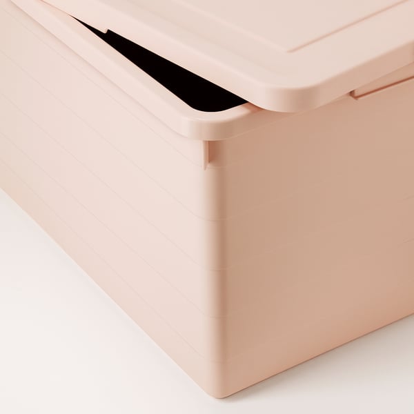 Closed light pink plastic storage box with a snap-on lid and black handle, showing quality and design.