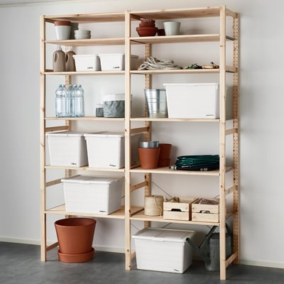 Wooden shelves with white boxes, water bottles, plant pots, and gardening tools.