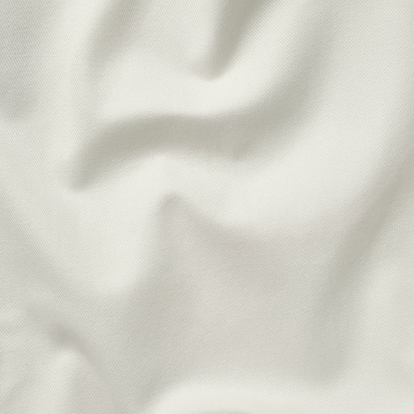 Close-up of a fine, textured white fabric, showcasing its intricate weave and depth, indicative of high-quality cotton.