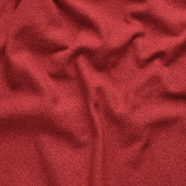 Close-up of rich, textured, red fabric with subtle melange effect, showcasing its soft and high-quality appearance.