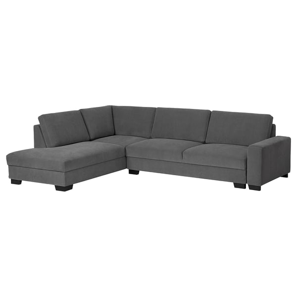 A modern, dark grey, l-shaped SÖRVALLEN sofa with a minimalist design and sturdy wooden legs.