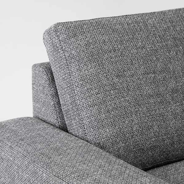 Close-up of a modern sofas arm and backrest, showcasing its sleek design and plush cushions.