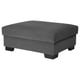 Option: The SÖRVALLEN footstool is grey, rectangular with angled front. It is upholstered in grey textured fabric. Four wooden legs support it.