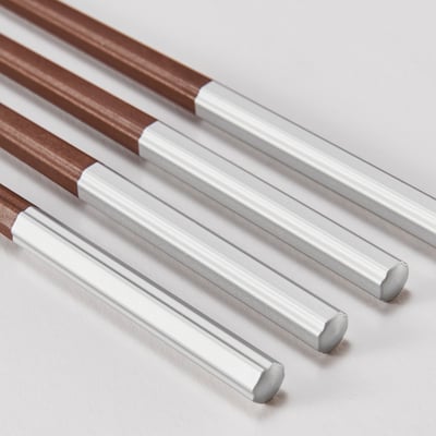 Four pairs of octagonal chopsticks, half silver and half brown, arranged neatly. High-quality finish, gripped-friendly surface.