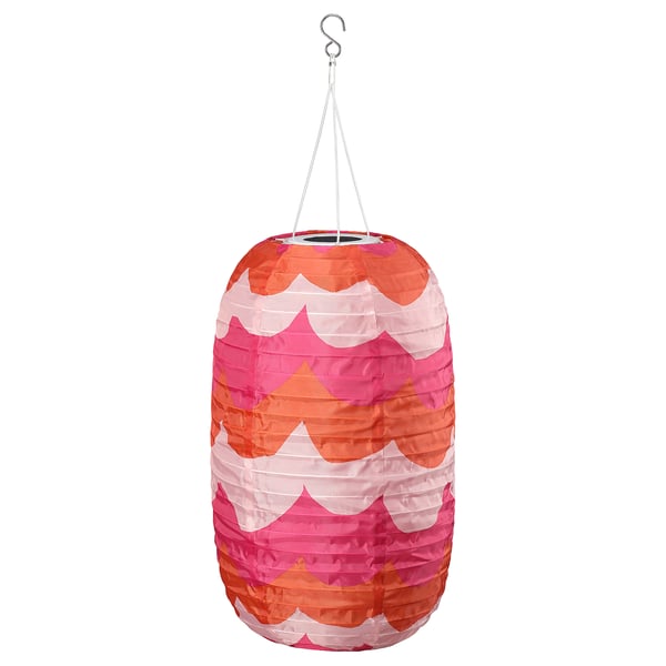 SOLVINDEN solar lantern, colorful waves, hangs by string, emits soft light.