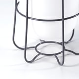 Modern, white table lamp with grey metal base and hooks, showcasing sleek design and quality materials.