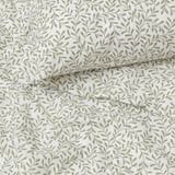 Leaf-patterned bedding, crease-free, breathable, recycled polyester, eco-friendly design.