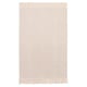 A cream-colored SORTSÖ cotton rug with fringe on both ends.