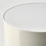 Modern table lamp with sleek white design, smooth edges, and rounded top, emitting soft, comforting light.