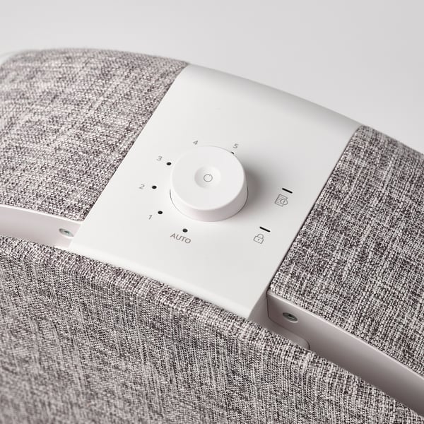 STARKVIND air purifier control panel with dial settings 1-5 and auto mode. Sleek fabric-like exterior.