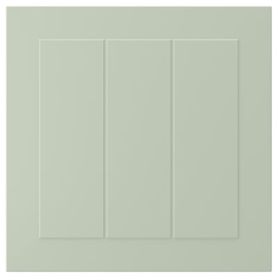 A STENSUND cabinet door in green with grooved panels and a smooth finish.