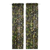 Two dark green curtains with colorful forest patterns hang side by side, adding a whimsical touch to any room.