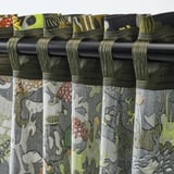 Close-up of curtains featuring a forest pattern. The heading tape lets you create pleats with hooks.